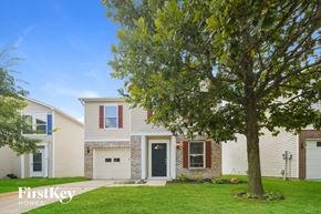 Noblesville house for rent - a white house with a large tree in front of it