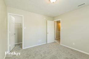 Noblesville house for rent - a bedroom with two closets and a door to a closet