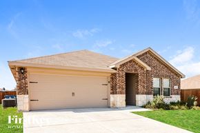 Josephine house for rent - a house with a garage door in front of a lawn