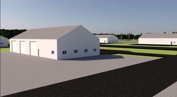 N. Chesterfield apartment for rent - A large white barn with a grey roof is situated in a field.