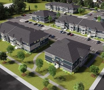 Brandon apartment for rent - an aerial view of an apartment complex with cars parked in a parking lot