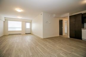 Brandon apartment for rent - A room with wooden floors and white walls.