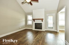 Clarksville house for rent - the living room has a fireplace and hardwood floors