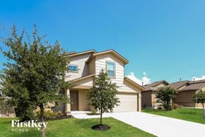 San Antonio house for rent - a house with a driveway and trees in front of it