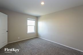 San Antonio house for rent - a bedroom with white walls and a window and carpet