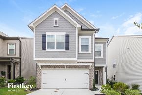 Austell house for rent - a gray house with a white garage door