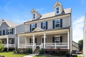 Canton house for rent - the front of a house with a porch and a white porch swing