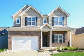 Westfield house for rent - a brick house with a white garage door