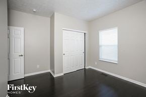 Westfield house for rent - the living room of an empty house with a door and a window