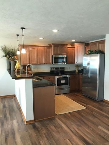 Lincoln house for rent - a kitchen with stainless steel appliances and wooden cabinets