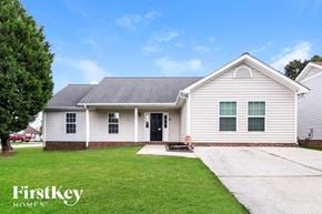 Greensboro house for rent - a white house with a yard and a driveway