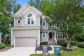 Greensboro house for rent - A house with a grey garage door and a grey roof.