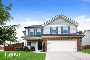 Dawsonville house for rent - a suburban house with a white garage door