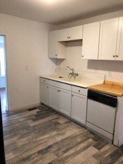Franklinton apartment for rent - a kitchen with white cabinets and a sink