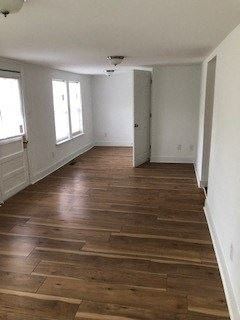 Franklinton apartment for rent - a living room with wooden floors and white walls