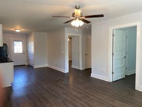 Franklinton apartment for rent - A living room with a ceiling fan and hardwood floors.