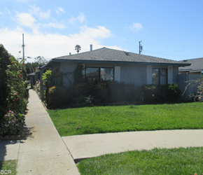 Lompoc apartment for rent - A house with a grey roof and a green lawn in front.
