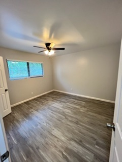 Lompoc apartment for rent - A room with a ceiling fan and a window.