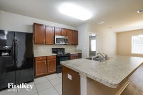 Clermont house for rent - a kitchen with a counter top and a sink