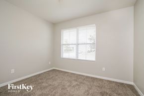 Clermont house for rent - a spacious room with carpet and a window