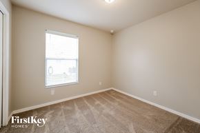 Lehigh Acres house for rent - a spacious room with carpet and a window