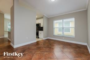 Wesley Chapel house for rent - the living room and kitchen of an empty house