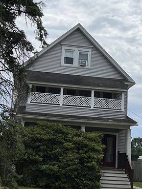 Summit apartment for rent - the front of a house with a porch on top of it