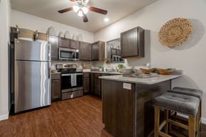 Fayetteville apartment for rent - a kitchen with stainless steel appliances and a counter top