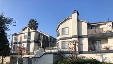 Long Beach apartment for rent - A two-story building with a balcony on the second floor.