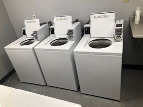 Long Beach apartment for rent - Three white toilets are lined up in a row.
