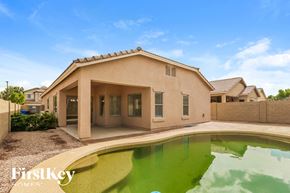Surprise house for rent - a house with a pool in front of it