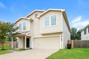 Cypress house for rent - a beige house with a driveway and a yard