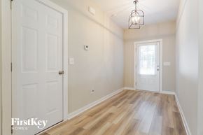 Jasper house for rent - an empty room with a white door and a light fixture