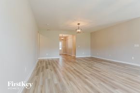 Jasper house for rent - the living room and dining room are spacious and light wood flooring