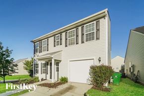 Charlotte house for rent - A two-story house with a garage is for sale.
