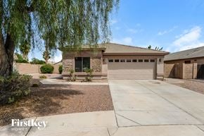 Mesa house for rent - a house with a driveway and a garage door