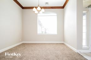 Edmond house for rent - a empty room with a window and a carpeted floor