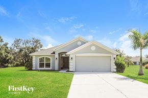 Punta Gorda house for rent - a home with a lawn and a driveway