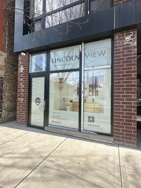 Chicago apartment for rent - the window of the new view store is shown from the sidewalk