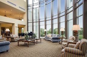 Landover apartment for rent - a large lobby with couches and chairs and large windows
