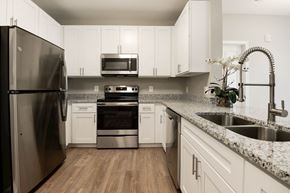Landover apartment for rent - a kitchen with granite counter tops and stainless steel appliances