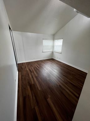 Seal Beach apartment for rent - A room with wooden floors and white walls.