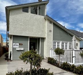 Seal Beach apartment for rent - A house with a for rent sign in front of it.