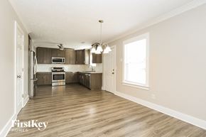 Thompsons Station house for rent - A spacious kitchen with wooden floors and a large island.