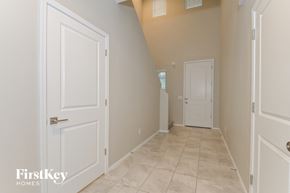 Tucson house for rent - a hallway with white doors and a door to a closet