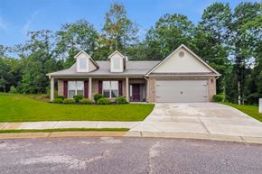 Statham house for rent - a house with a driveway and a lawn