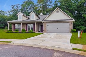 Statham house for rent - a house with a driveway and a garage door