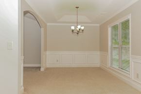 Statham house for rent - a dining room with a large window and a chandelier