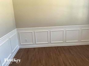 Dallas house for rent - a small room with white walls and wooden floors