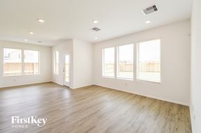 La Marque house for rent - an empty living room with wood floors and white walls